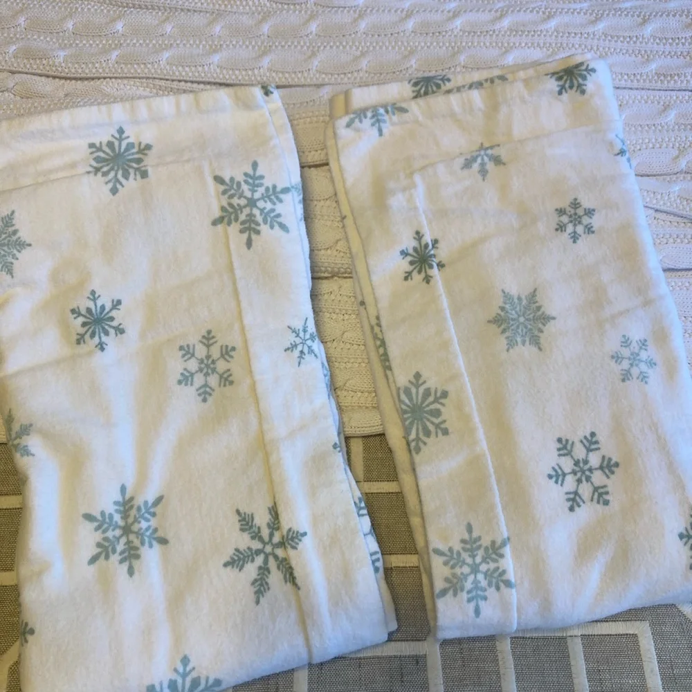 Pair of premium white flannel with turquoise snowflake design Euro shams